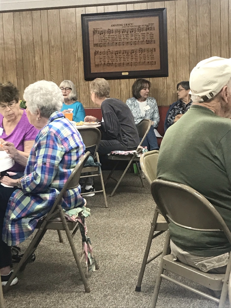 Senior Citizens Talking and Eating